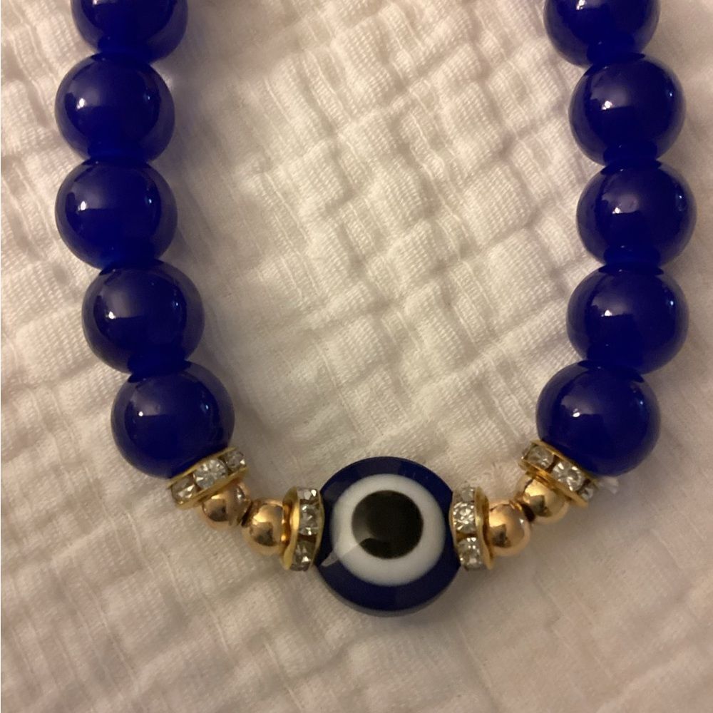 NWT stretch bracelet, Blue, gold, beads, charm eye protection